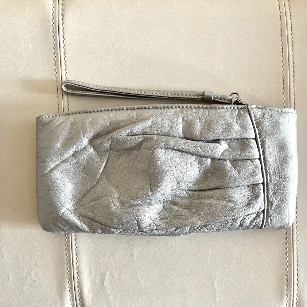 Metallic leather wristlet by Cache.